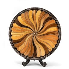 A large Anglo-Ceylonese ebony and specimen wood centre table
